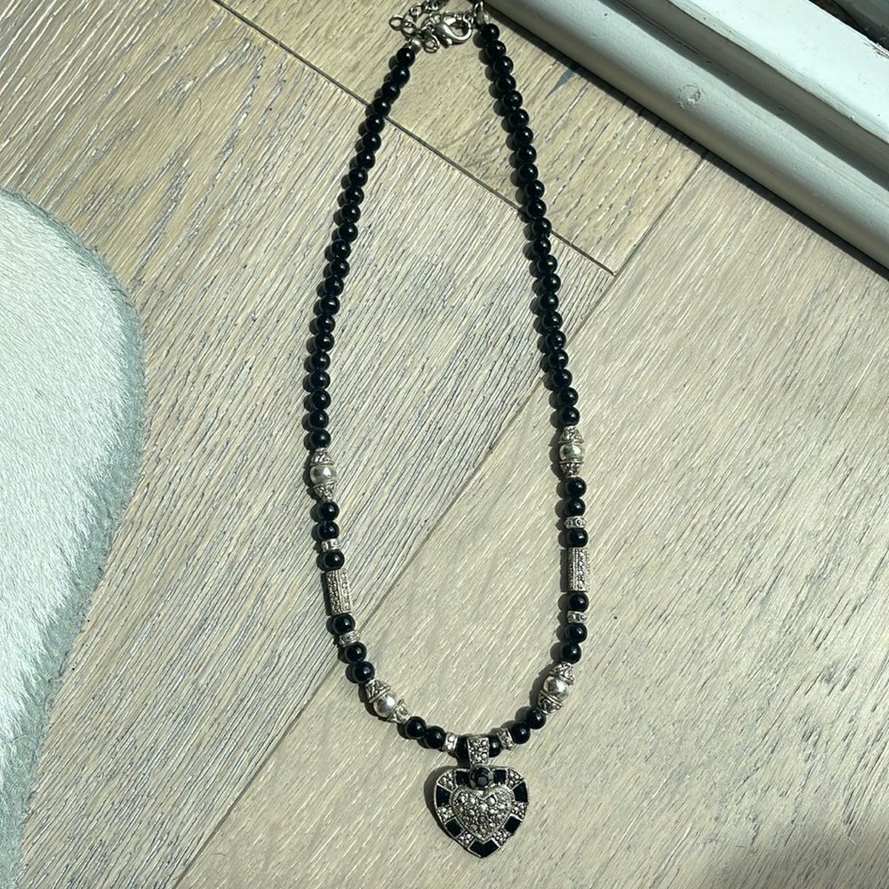 Cute black beaded necklace with heart.